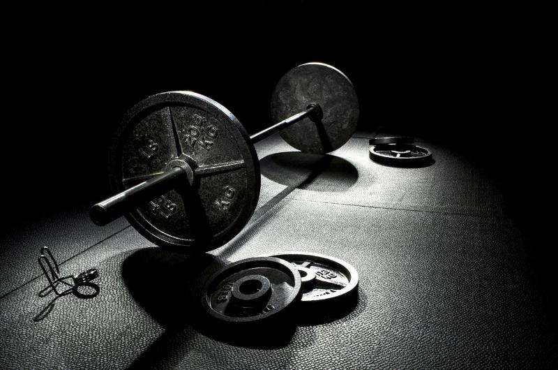 Weights on black matt at gym